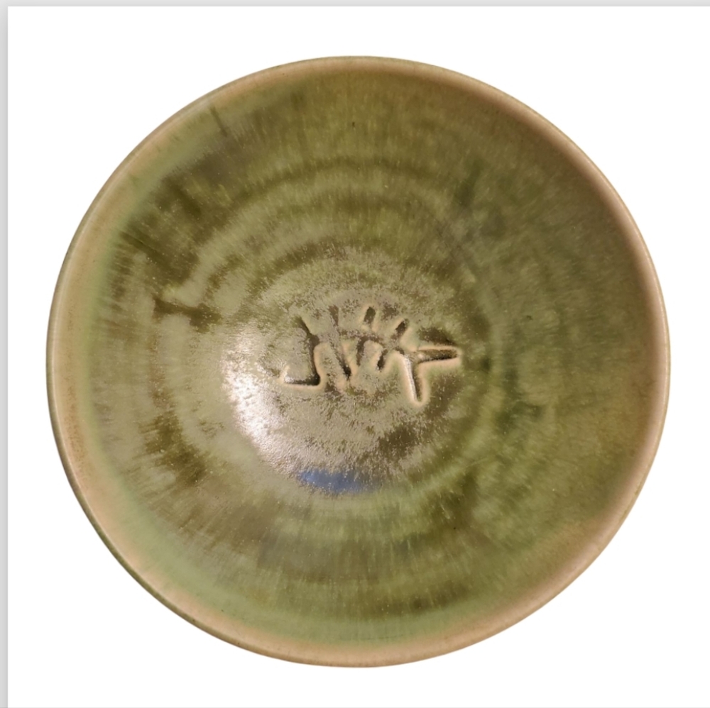 Hand tossed stoneware bowl. Green. Signed on bottom